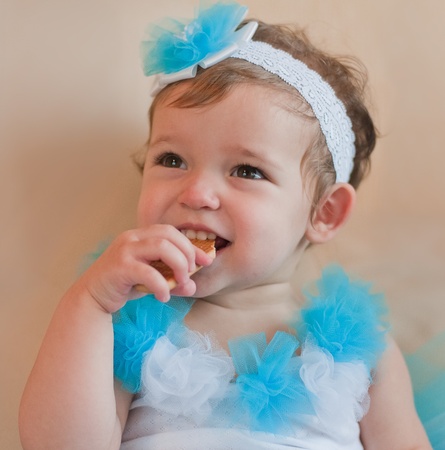 Little girl eats cookieの写真素材