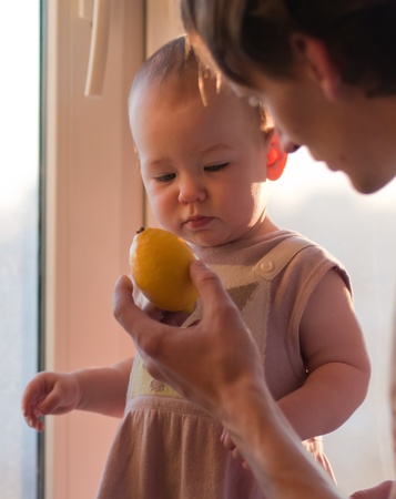Father gives his daughter lemonの写真素材