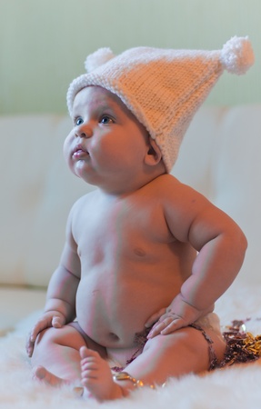 Portrait of baby in hat looking leftの写真素材