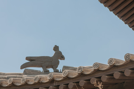 the horizontal view of the mythology bird on the roofの写真素材