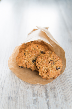 Oatmeal cookies in the craft paper bagの写真素材