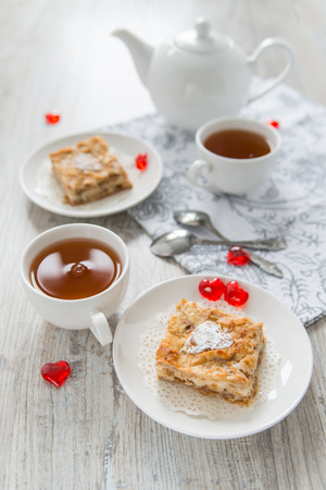 Two pieces of apple pie with teaの写真素材