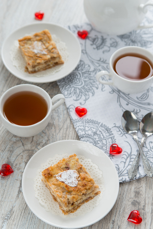 Two pieces of apple pie with teaの写真素材