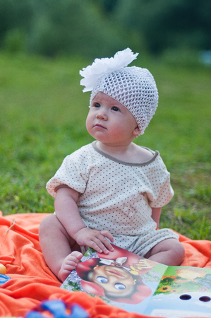 Little girl in the cute white hat portraitの写真素材