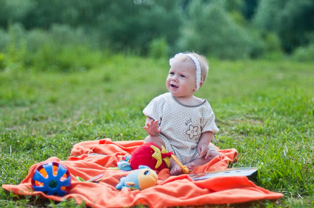Portrait of the Little girl on the orange towelの写真素材