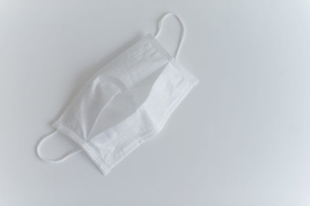 Laying medical mask on the white background