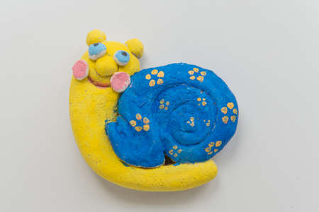 Colourful handmade snail made of clayの写真素材
