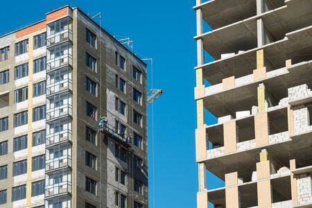 New built houses with unfinished construction works. Construction and develope conceptの写真素材