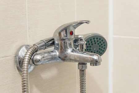 Dirty calcified shower mixer tap, faucet with limescale on it, close up photoの写真素材