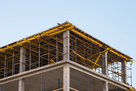 Scaffolding system on the construction new building. Development and real estate conceptの写真素材