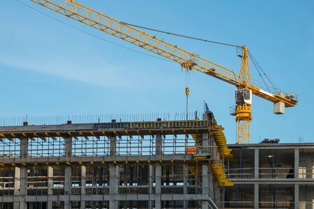 Construction crane near new built house. Construction and developing conceptの写真素材