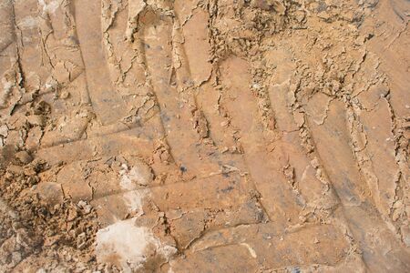 Tyre track on dirt sand or mud. Car drive on sand. off road track backgroundの写真素材