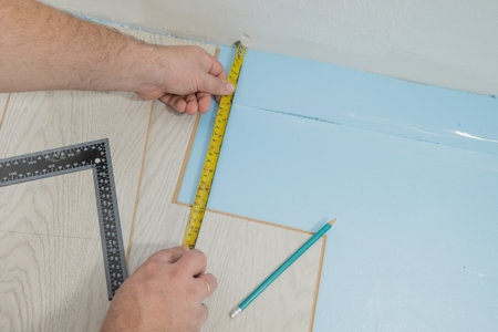 Floor renovation. Measuring before setting of the laminate floorの写真素材