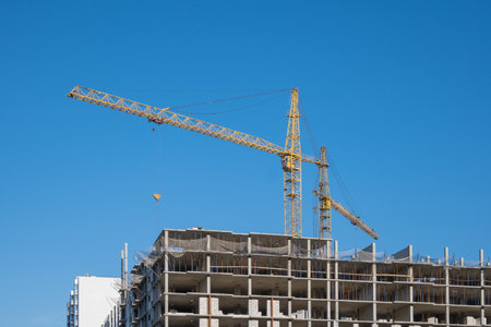 Construction cranes on the background of the sky. Building the skyscraper.の写真素材