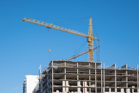 Construction crane on the background of the sky. Building the skyscraper.の写真素材