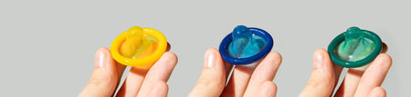 gray horizontal banner. Colored condoms.