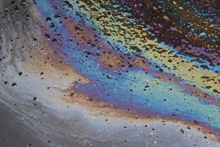 Oil slick on asphalt road background. Stylish background image.の写真素材