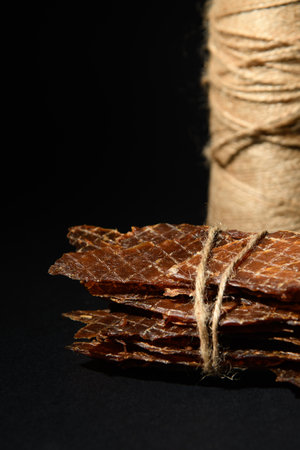 Chicken jerks tied with rope. Twine in the background.の写真素材