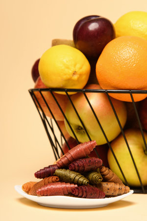 Fruit basket, white plate with pastila. vertical photo.の写真素材