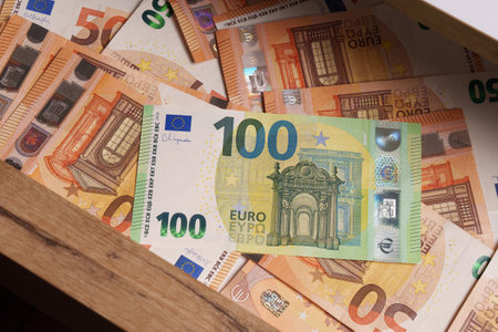 100 euro bills and 50 euro bills in a drawer. Savings. Financial concept.の写真素材