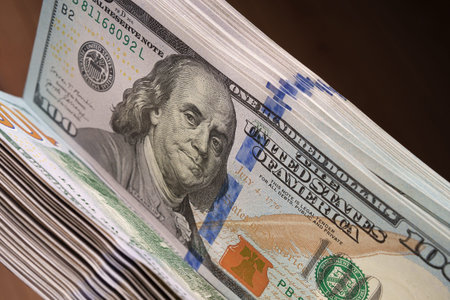 Close-up of 100 dollar banknotes. A large number of them. Financial concept.