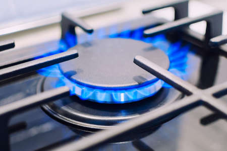 Burning gas burner on the stove.  Photo with shallow depth of focus.の写真素材