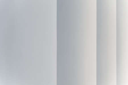 Light gray abstract background with vertical stripes that taper in the perspective as steps.の写真素材