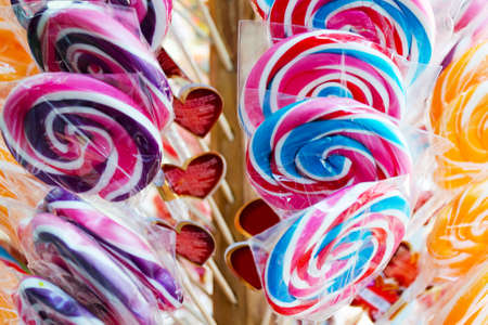 Sale of colored lollipops with stickers in the form of hearts.の写真素材