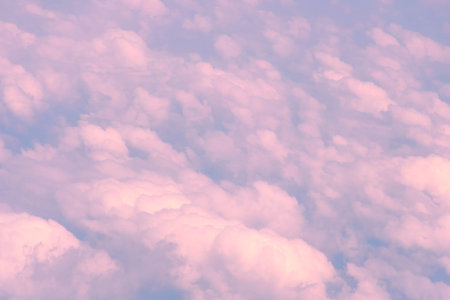 Pink clouds, view from airplane. Awesome, fabulous abstract background.
