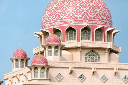 Islamic architecture, details of mosque extrerior, dome with decorative pattern, arched windows, facade of oriental religious building. Putra Mosque, Malaysia, Cyberjaya.のeditorial素材