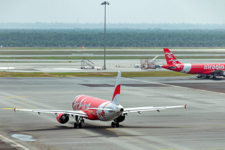 Malaysia, KLIA 2, 04-03-2018: Air Asia airplane taxiing at tarmac in Kuala Lumpur International...