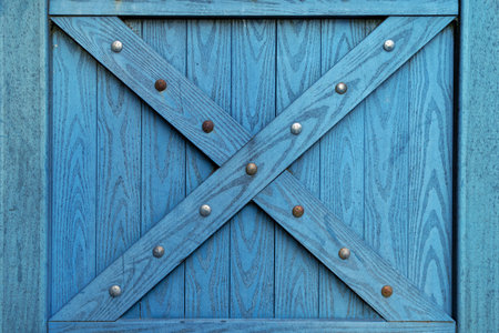Wooden background, blue color, with iron decor.の写真素材