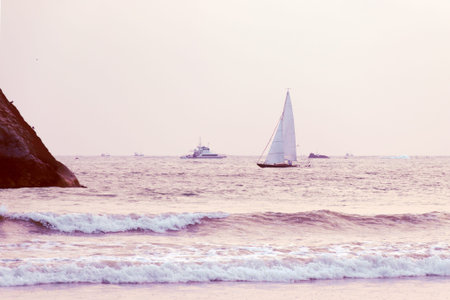 Sailboat in the sea, luxury summer adventure. Sailing in the wind through the waves at the sea. Travel and active lifestyle concept. Summer vacation backgroundの写真素材