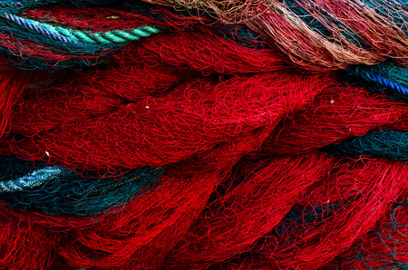 Fishing nets. rope texture, Background with blue and red ropes.の写真素材