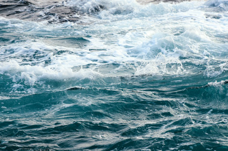 Stormy dark sea. Deep blue water from top view. Use for background, backdrop or design element in...