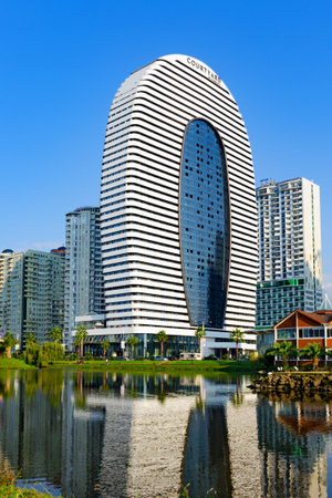 Batumi, Georgia, 2018-10-10: First Marriott Courtyard hotel in town. Marriott international.  Modern architecture, smooth forms. Vertical photo.のeditorial素材