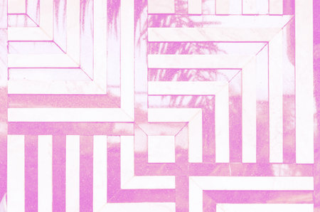Neon toned psychedelic background. Linear, angular pattern of marble tiles on the wall. Reflection...