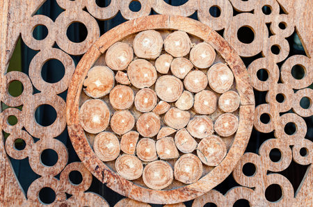 Wooden background made of round wooden pieces. Decorative elements for interior design.