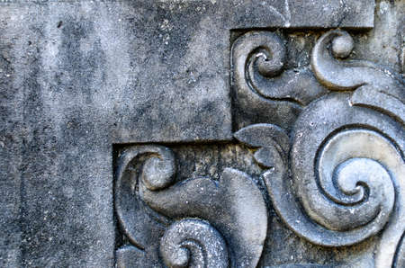 Gray old wall with carved elements. Bali, Indonesiaの写真素材