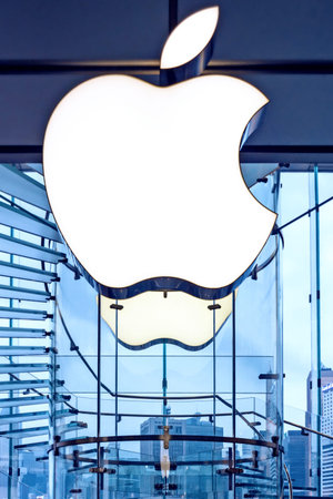 Apple sign on the Apple store glass wall,  close up.  Hong Kong, 2018-03-14. Vertical photo