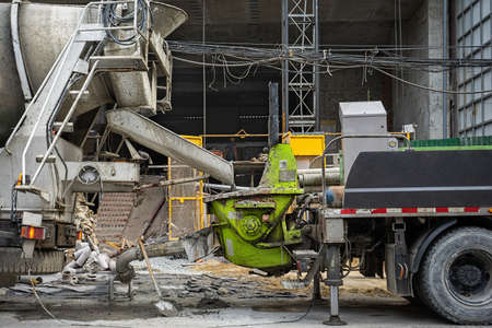 Cement is unloads from the truck mixer into the mortar supply tank.の写真素材