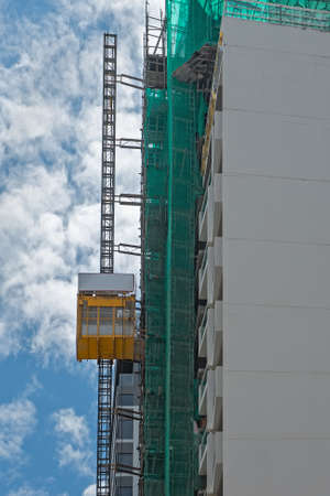 Hoist lift platform for transportation passenger and material at a construction site.  Construction elevator cage.の写真素材