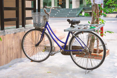 Side view of the old vintage bicycle on the street.の写真素材