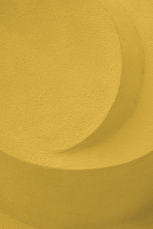 Abstract stone sculpture concrete yellow color. Embossed concrete architectural detailの写真素材