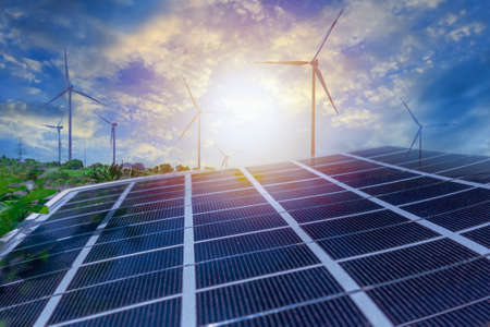 Solar panels and wind power stations. Renewable energy wind and solar generation. Defocused photo with soft focus.の写真素材