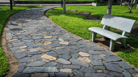 Stone pavement walkway in the park . Landscaping in the city park
