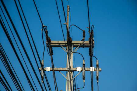 A cement pillar as an electrical power substation that is connected with multiple electrical cables...