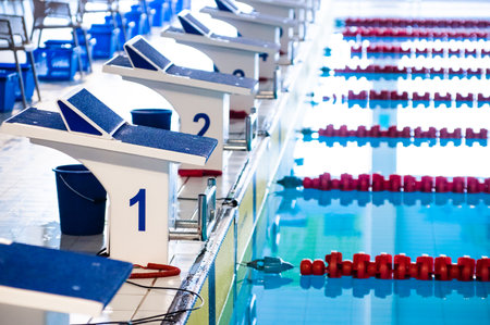 Aligned swimming starting block and platform with number 1の写真素材