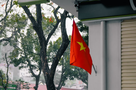 Vietnam flag hanging red on blurred bright backgroundの写真素材