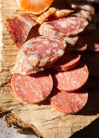 meat slices on a wooden board
